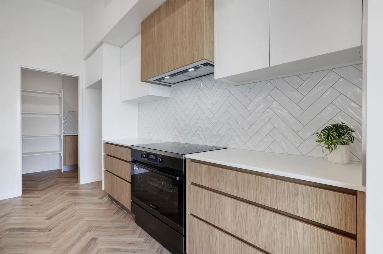 Farmhouse-style Kitchen With Large Island, Wood Floors — Master Cabinets Bundaberg in Kensington, QLD