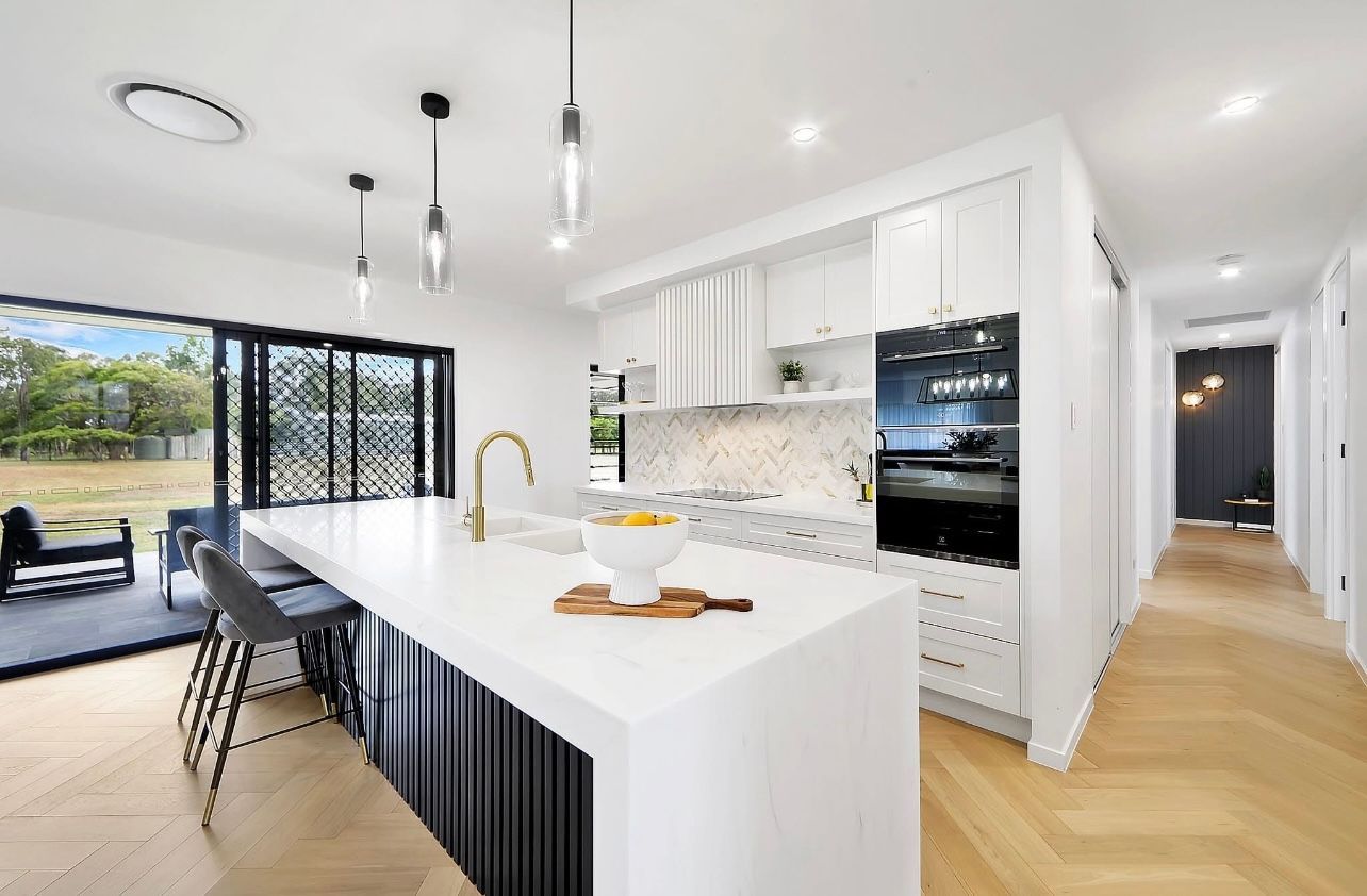 A Kitchen With Gray Cabinets, A Sink, And A Refrigerator — Master Cabinets Bundaberg in Kensington, QLD