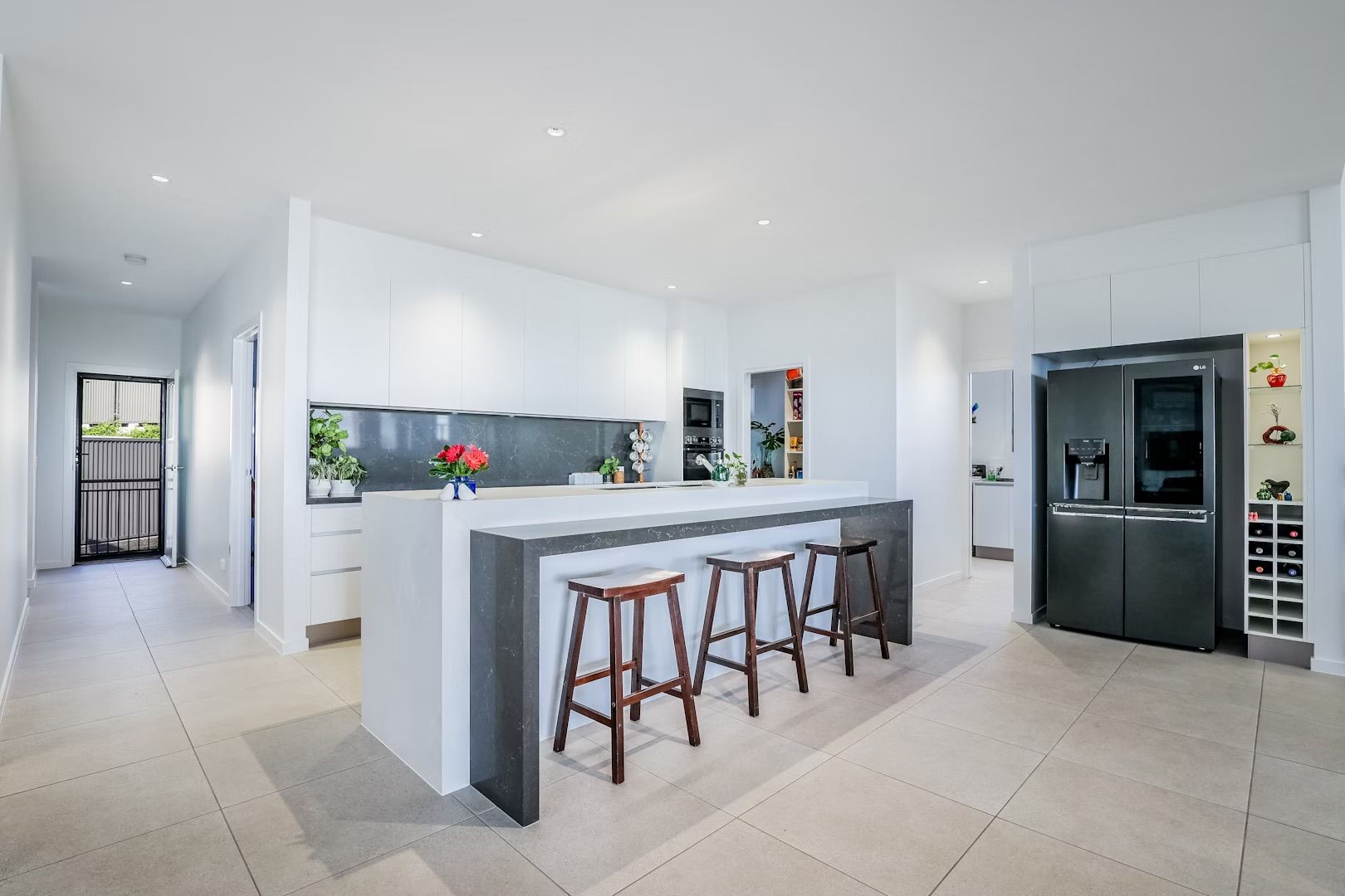 Modern Bathroom With Gray Tile Walls, Wooden Vanity — Master Cabinets Bundaberg in Kensington, QLD