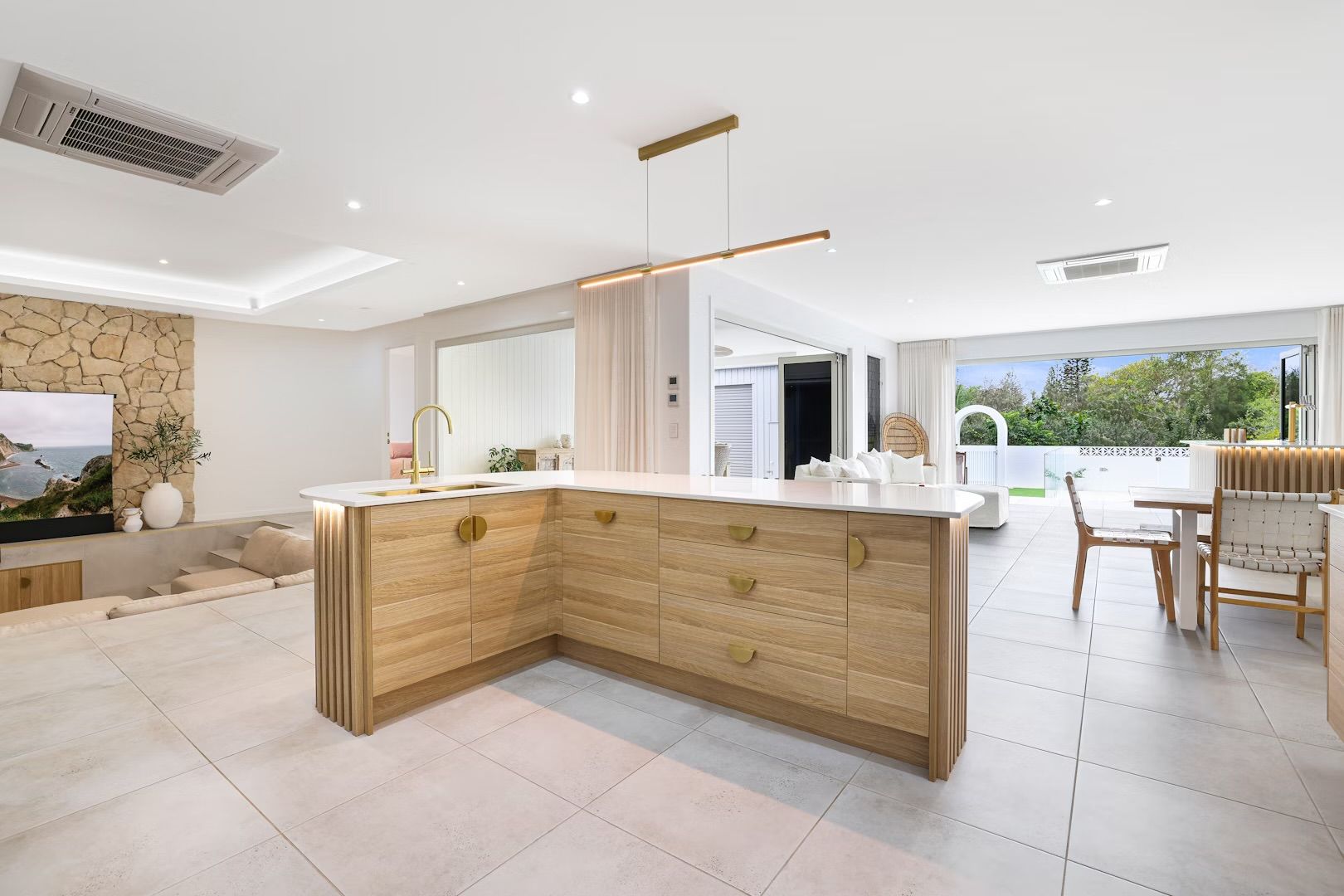 A Kitchen With Black Cabinets And Stainless Steel Counter Tops — Master Cabinets Bundaberg in Burnett Heads, QLD