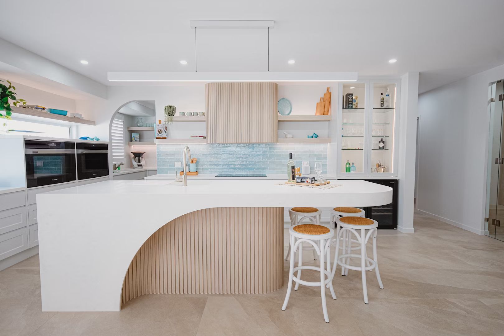 A Kitchen With A Wooden Counter Top And A Refrigerator — Master Cabinets Bundaberg in Gin Gin, QLD