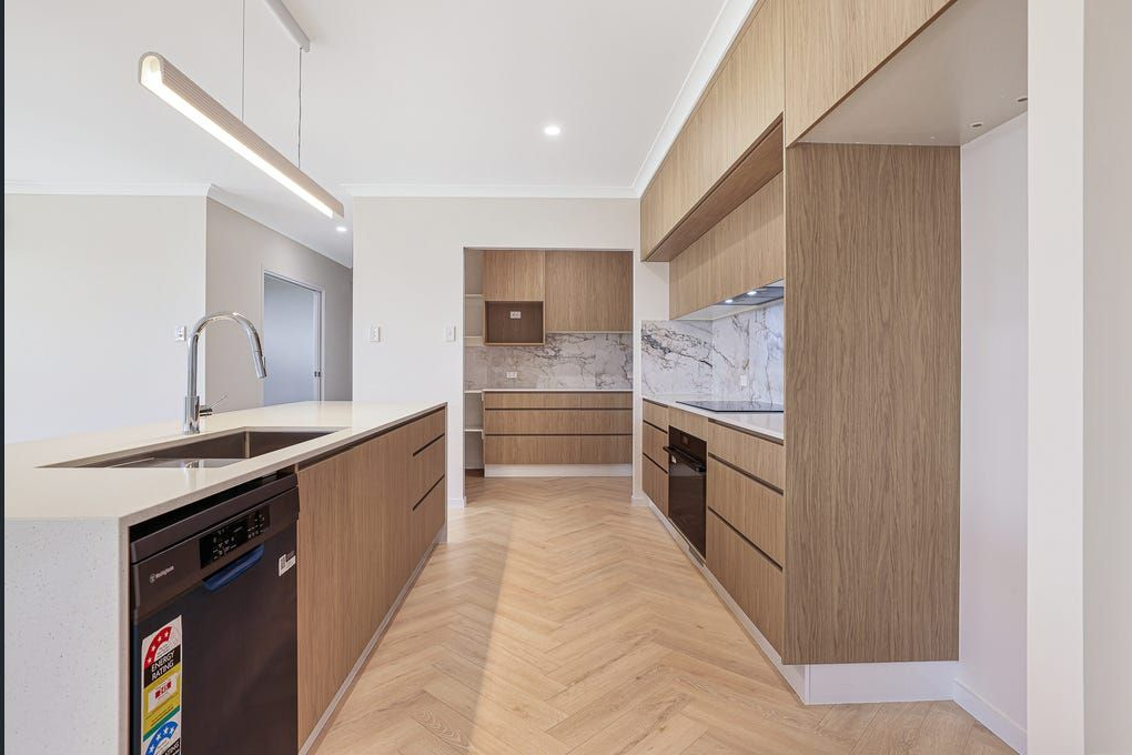 Modern Minimalist Kitchen and Herringbone Wood Flooring — Master Cabinets Bundaberg in Kensington, QLD