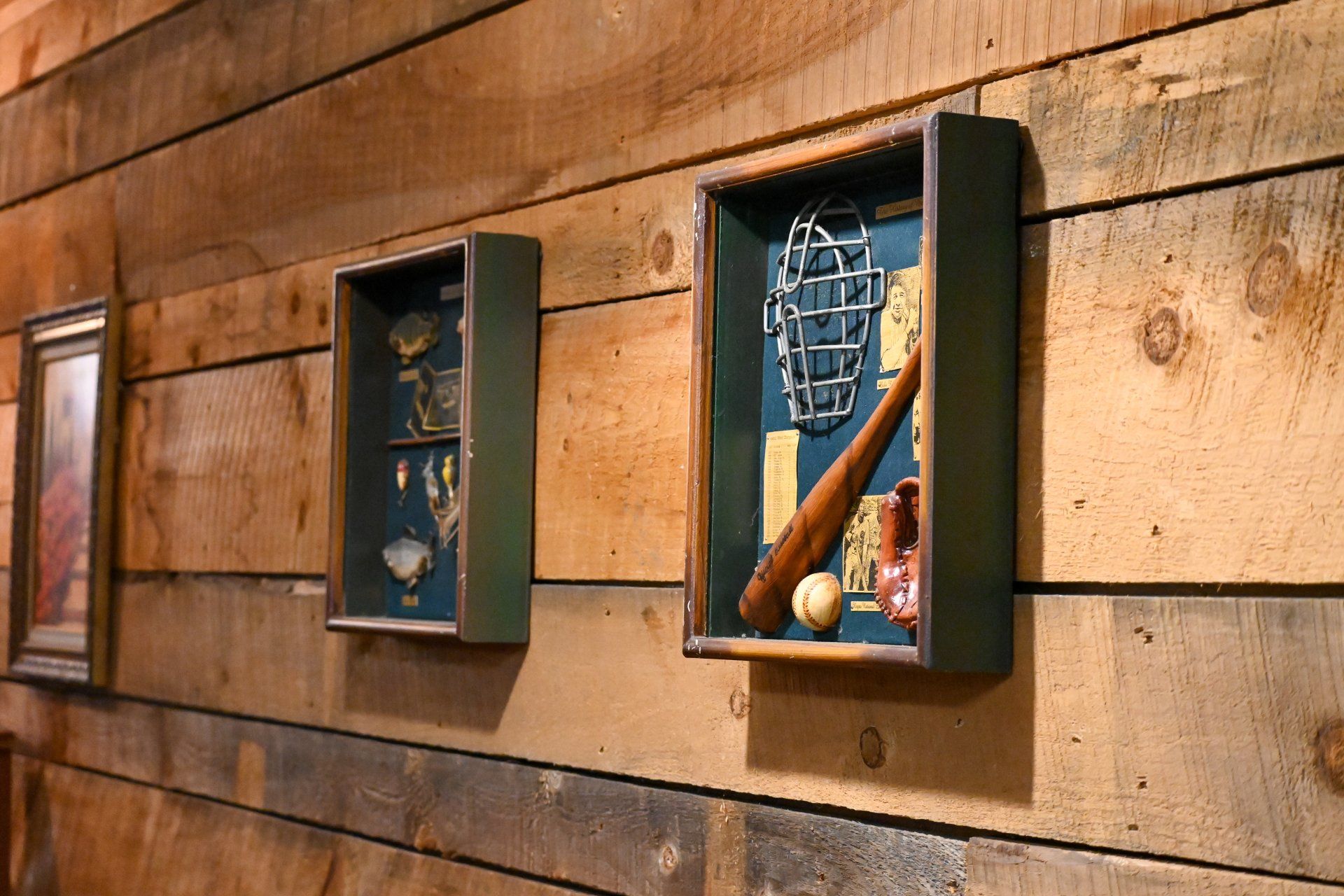 A wooden wall with a display of baseball memorabilia