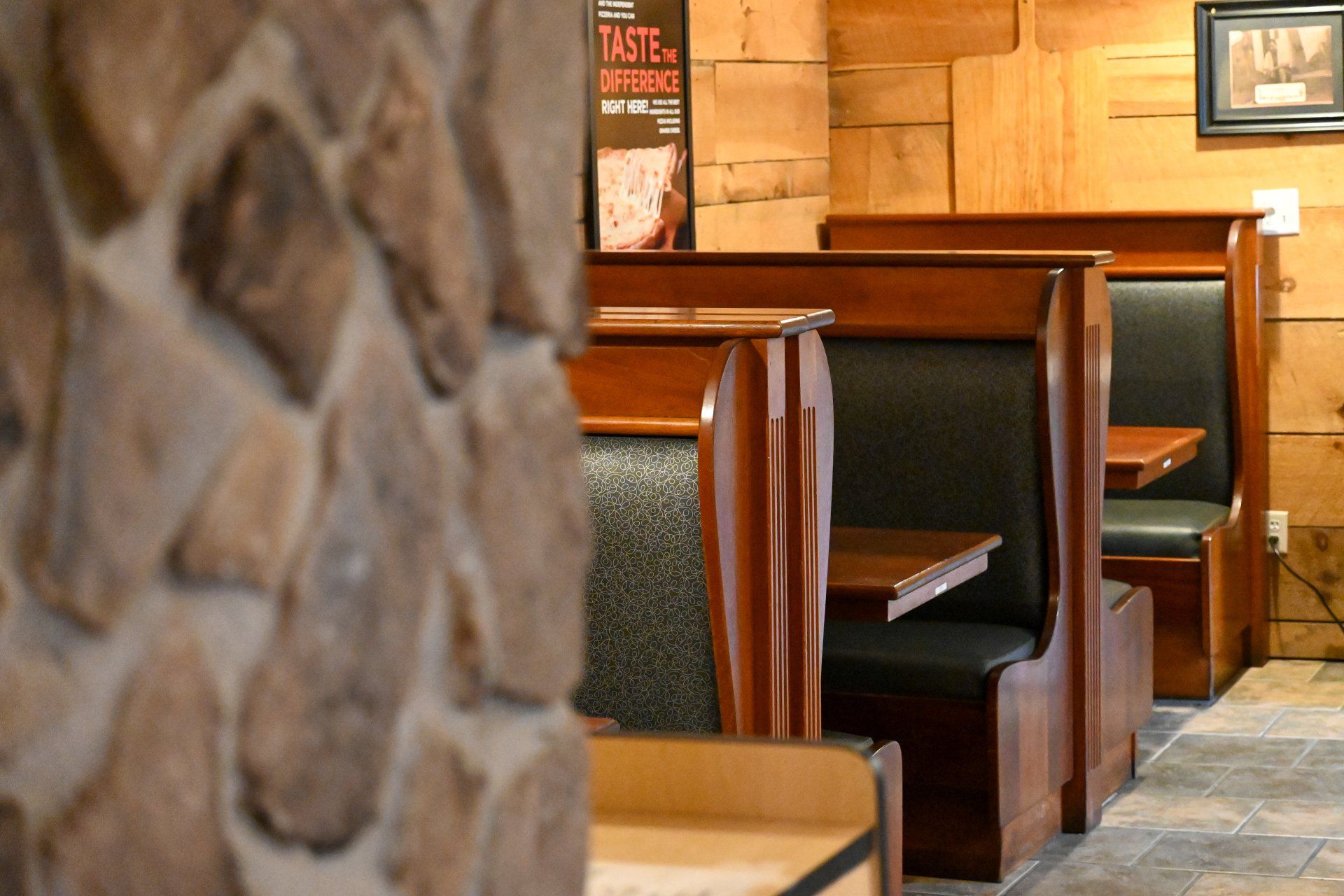 A restaurant with a sign that says taste on it