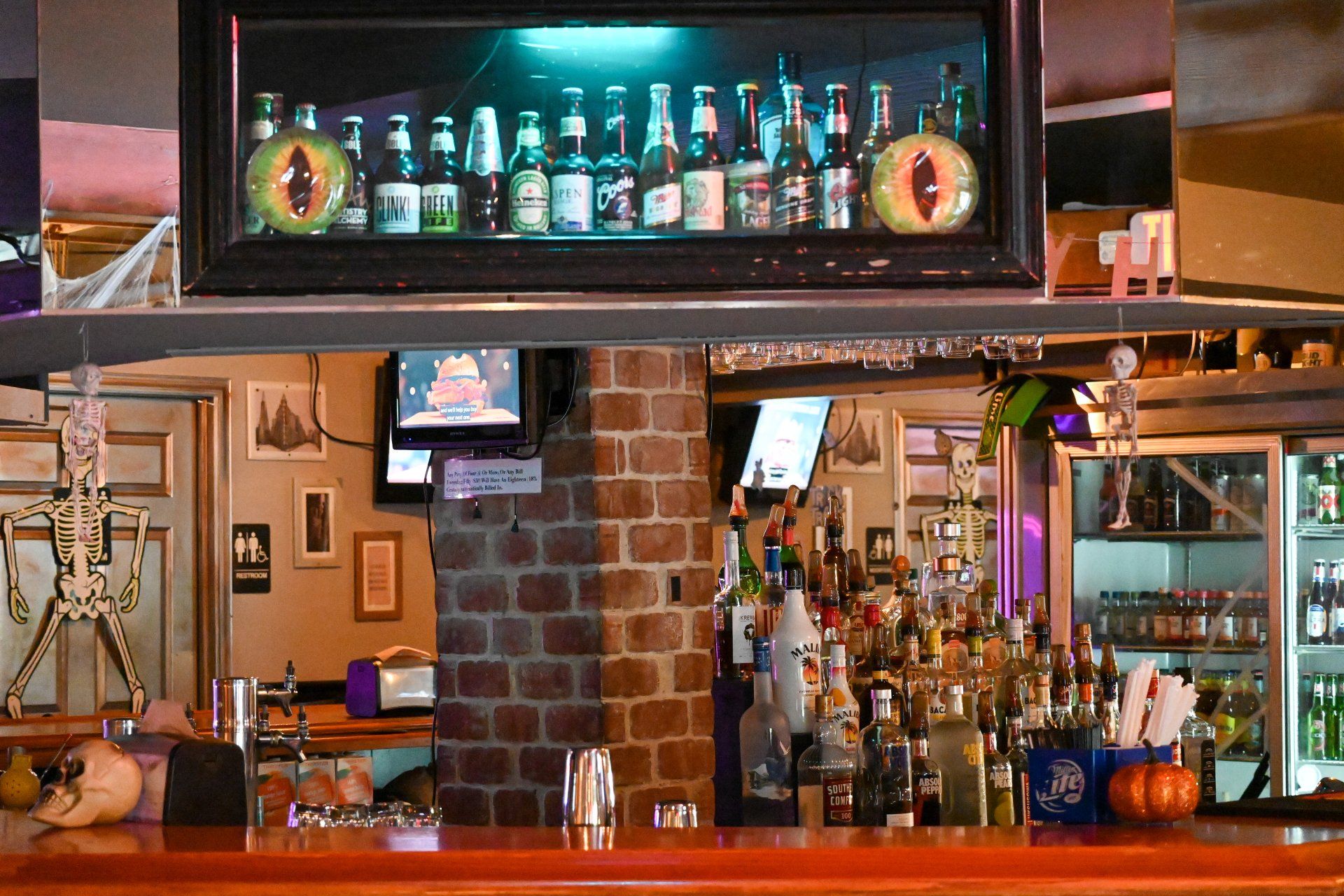 A bar with a lot of bottles of alcohol on it