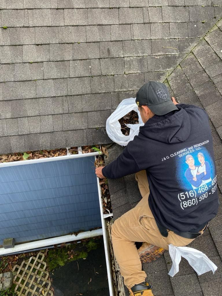 A gutter is sitting on top of a roof next to a deck.
