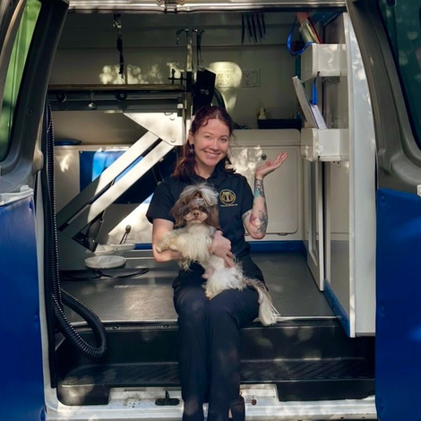 Ottillie holding her Shih Tzu Roman on the steps of Roman’s Empire’s Mobile Grooming van in Granite Bay, CA.