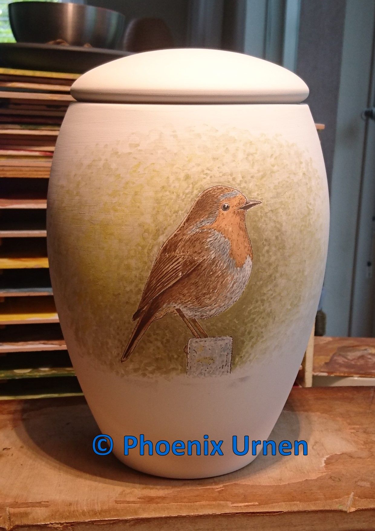 Urn Roodborstje geschilderd naar de rouwkaart