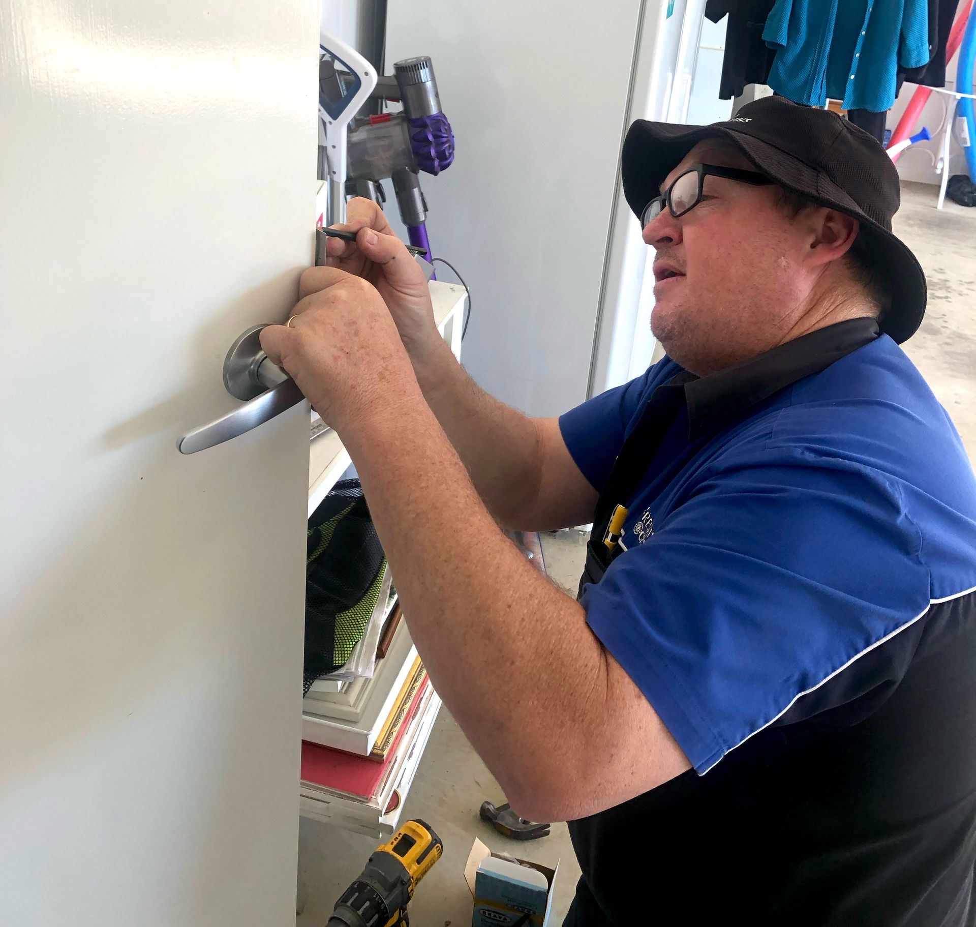 Locksmith Measuring Door For Lock — Locksmith in Toowoomba South, QLD