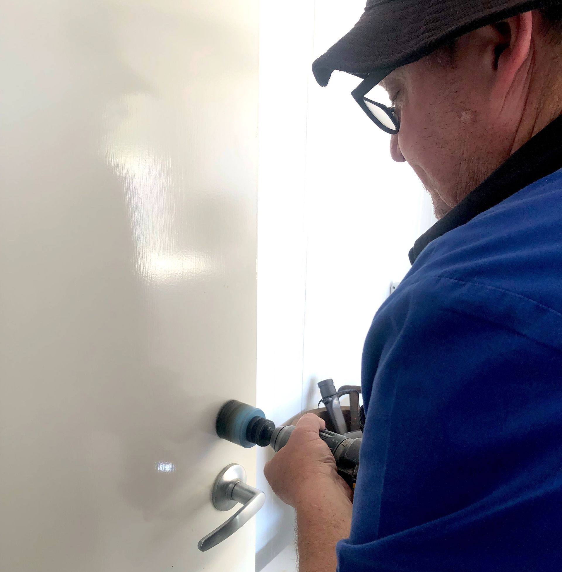 Professional Locksmith Installing A Lock — Locksmith in Toowoomba South, QLD