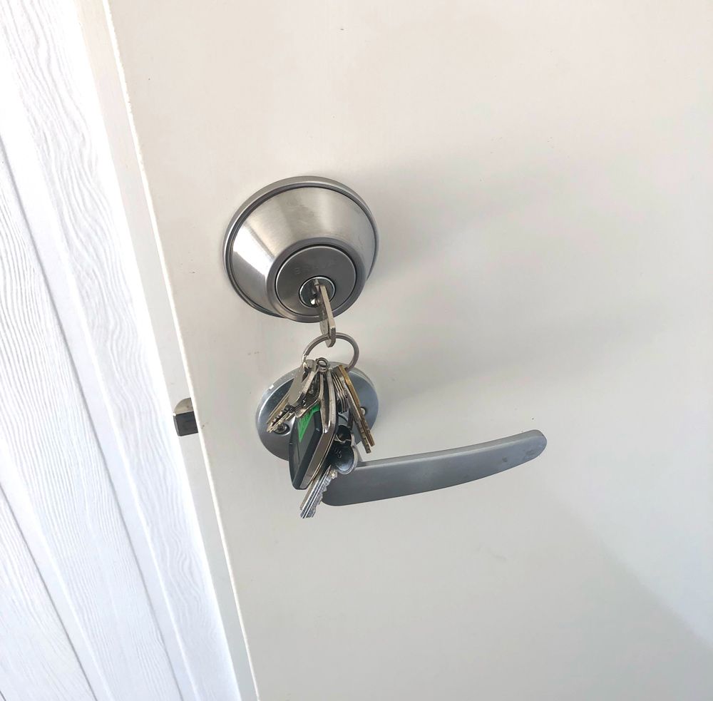 Keys Securely Attached To A Door Handle