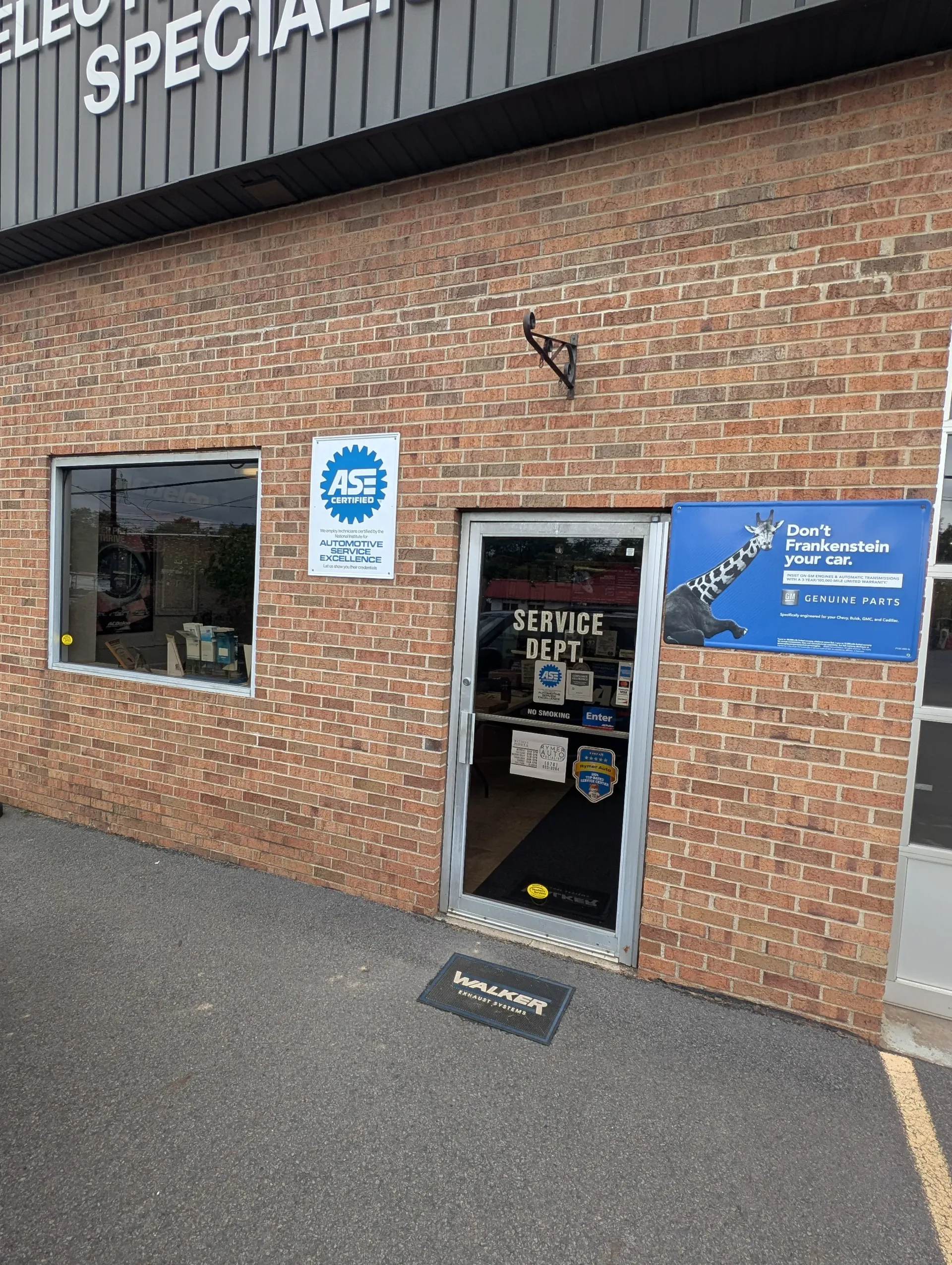 Exterior of a brick building with a business entrance | Rymer Automotive