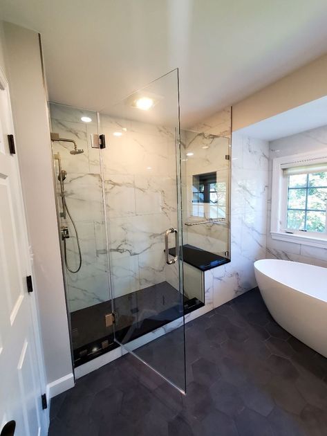 A bathroom with a toilet , sink , and shower.