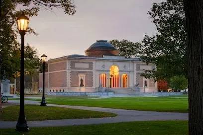Bowdoin College Museum of Art building at dusk with lit entrance