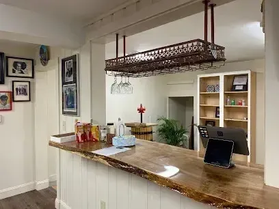 Chimney-Sweep-Portland-A kitchen with a wooden counter top and a wine rack hanging from the ceiling.