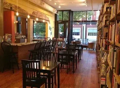 Chimney-Sweep-Portland-A restaurant with tables and chairs and lots of books on the shelves.