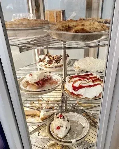 Chimney-Sweep-Portland-A variety of pies are displayed in a glass case.