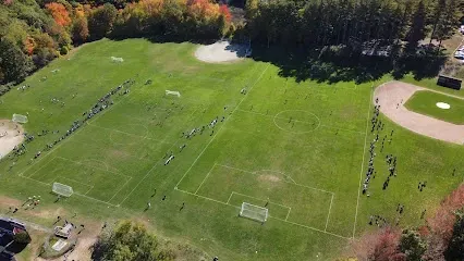 Aerial view of multiple soccer fields at Gowen Park surrounded by trees