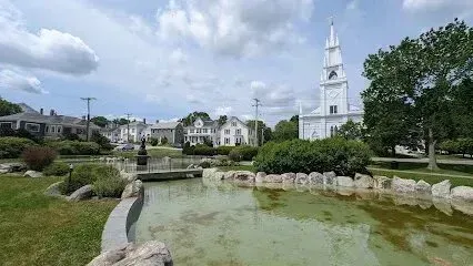 Chimney-Sweep-Portland-A red lighthouse with a blue sky in the background