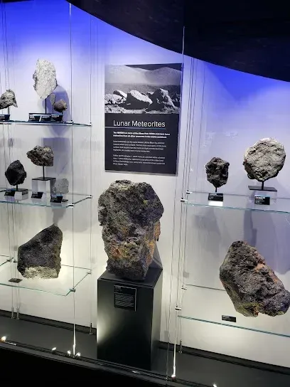 Chimney-Sweep-Portland-Water feature and miniature golf course with a wooden bridge and a roadside sign under a cloudy sky.