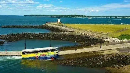 Chimney-Sweep-Portland-A yellow and blue bus is floating on top of a body of water.