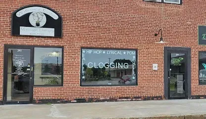 Storefronts inside Midtown Mall with brick exterior and retail signage