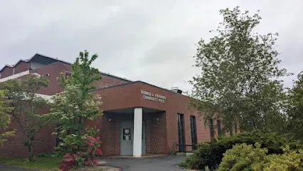 Chimney-Sweep-Portland-Red brick community center building with a sign reading 