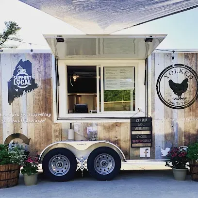 Chimney-Sweep-Portland-A food truck with a rustic wood exterior features an open serving window, a