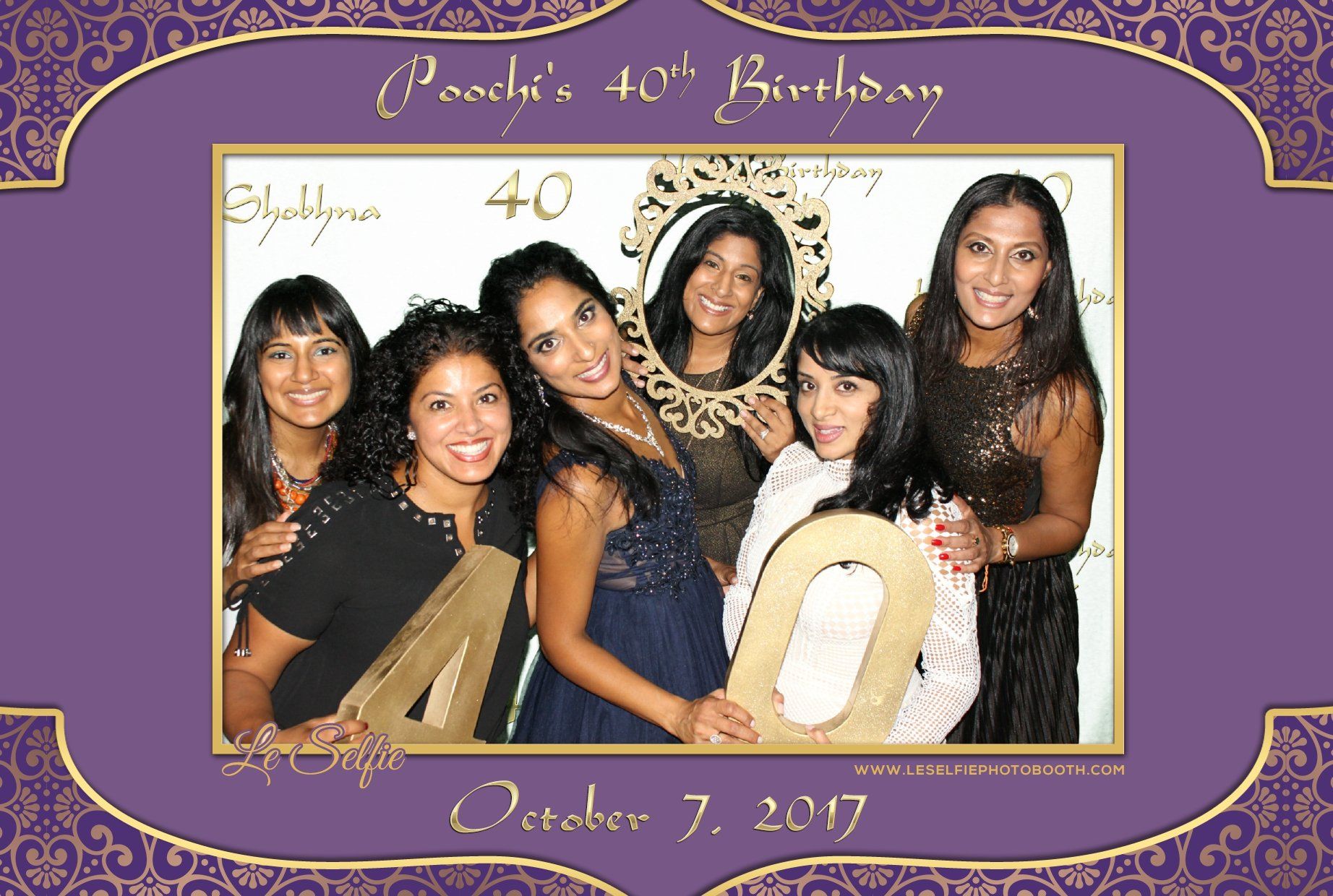 A group of women are posing for a photo for a 40th birthday