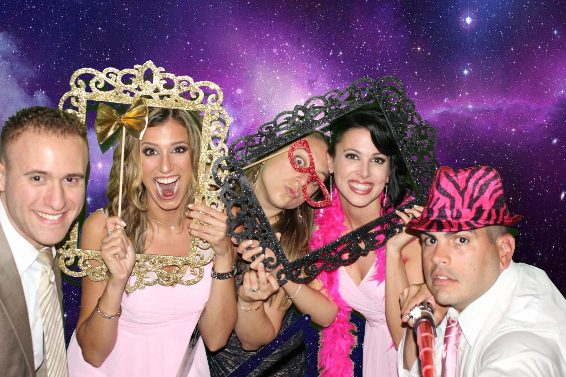 A group of people are posing for a picture in a photo booth.