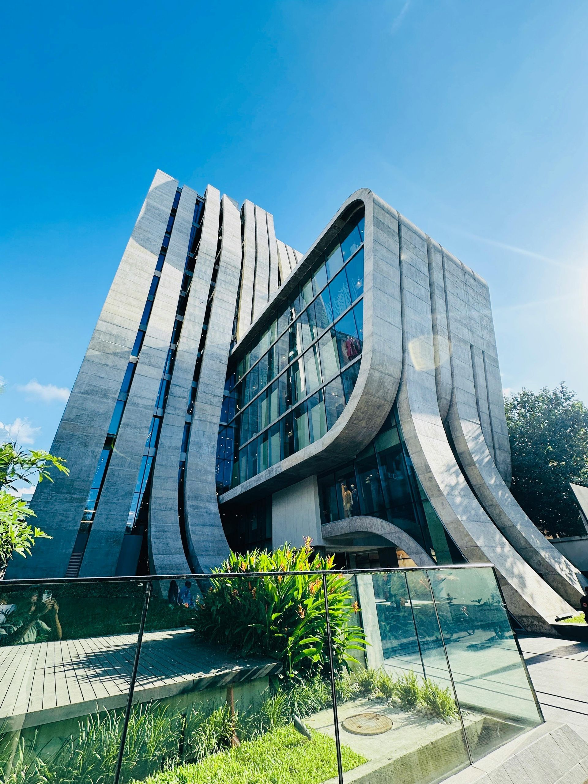 Modern grey building with curved facade
