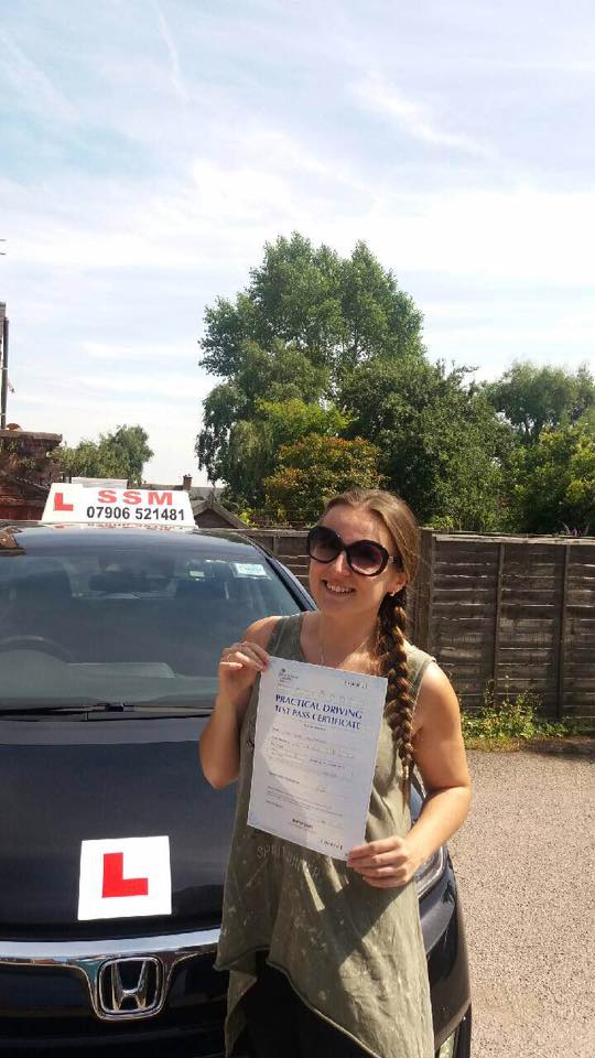 A woman passing the driving test
