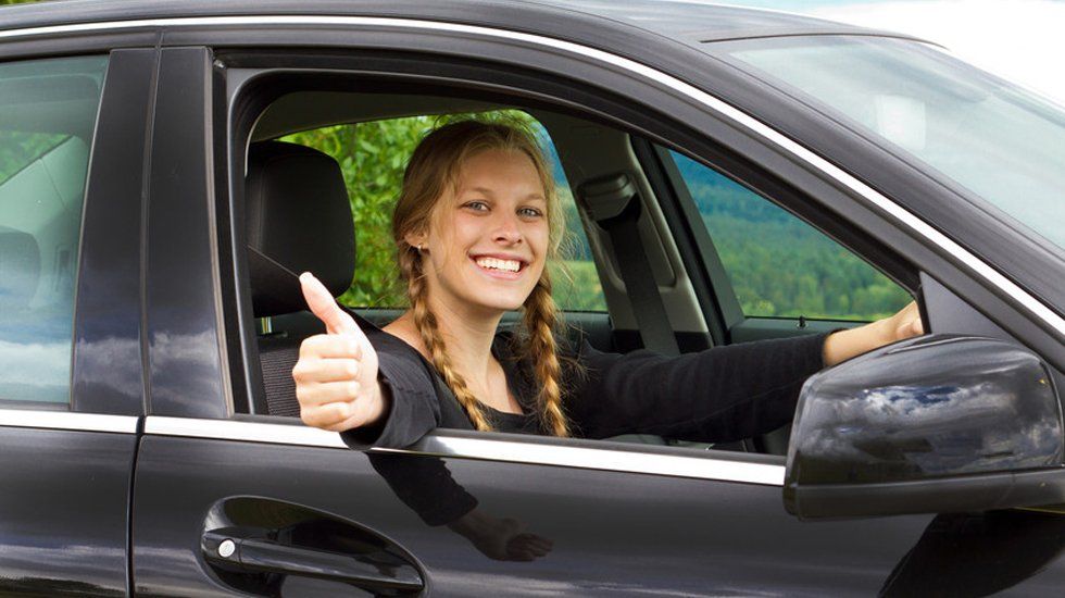 A girl showing thumbs up