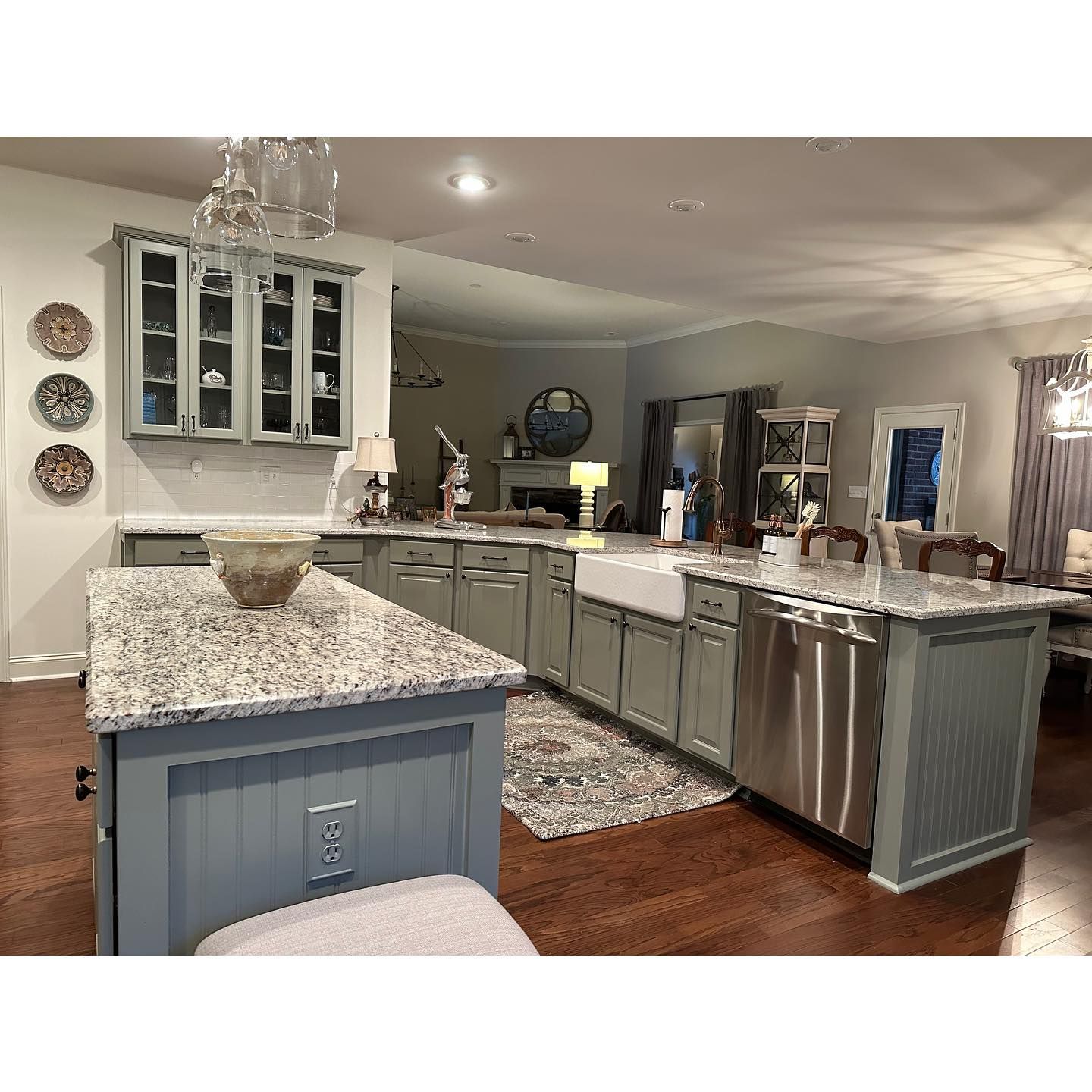 A kitchen with stainless steel appliances and granite counter tops.