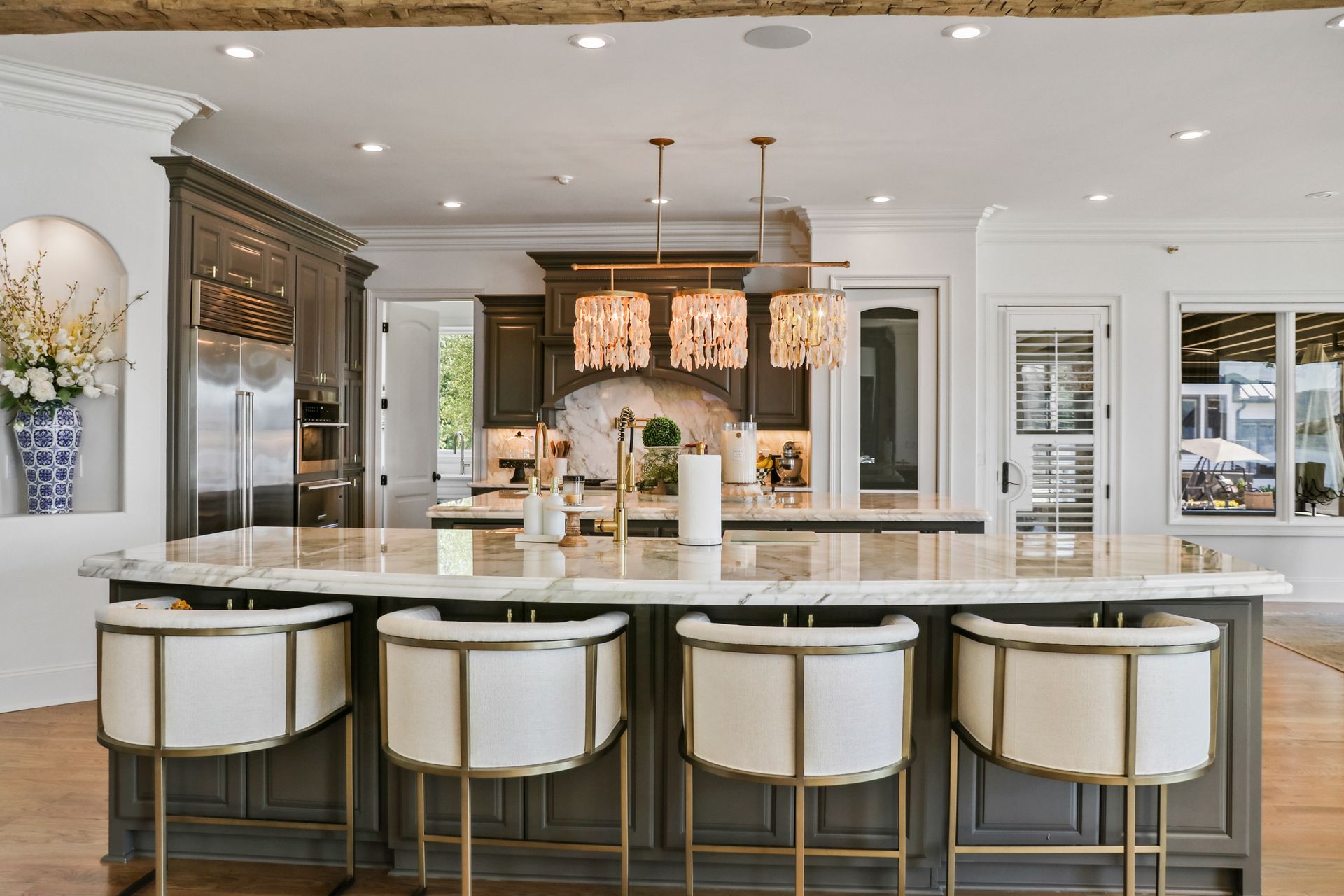 A large kitchen with a large island and stools.