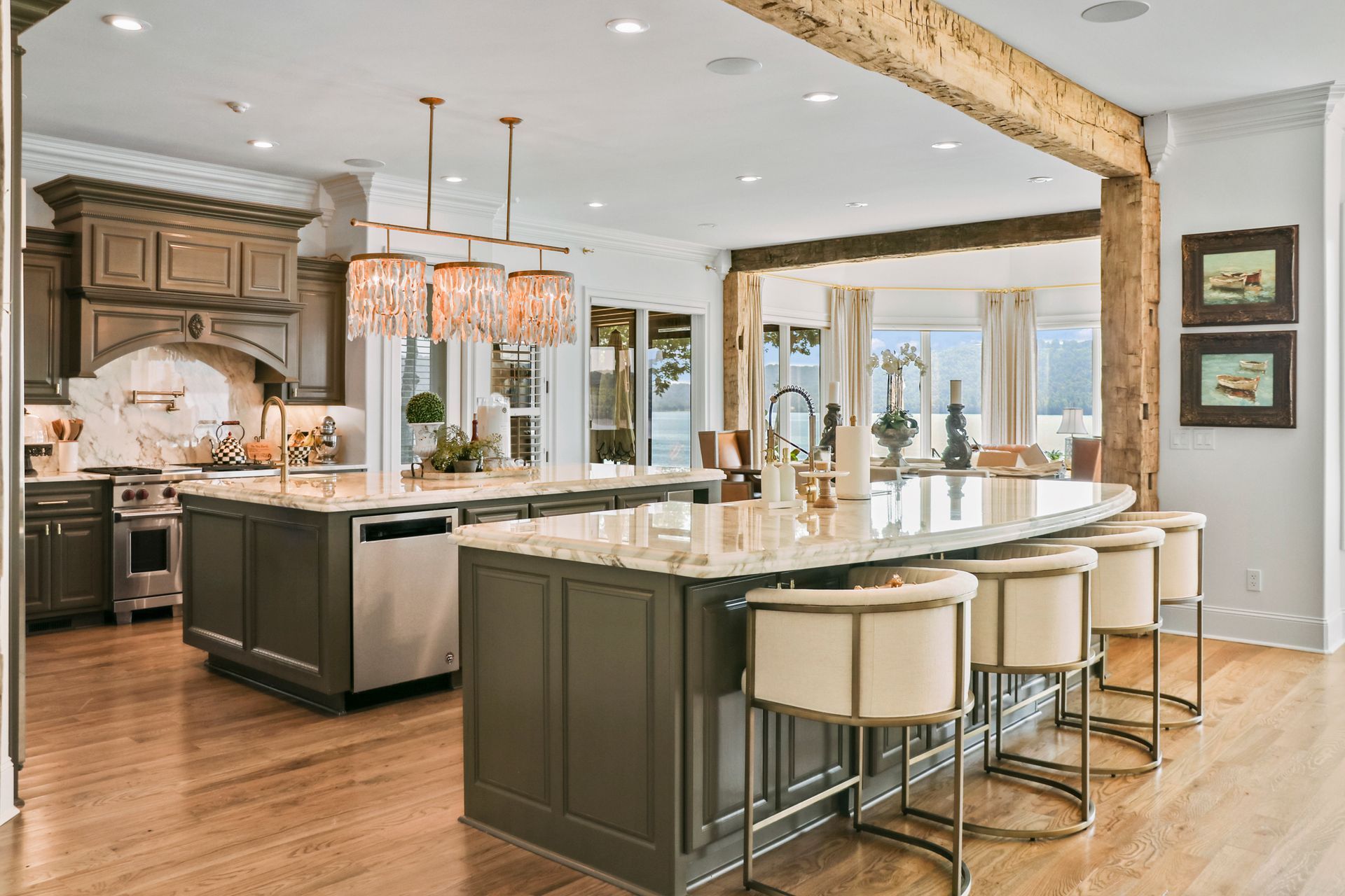 A large kitchen with a large island in the middle of it.