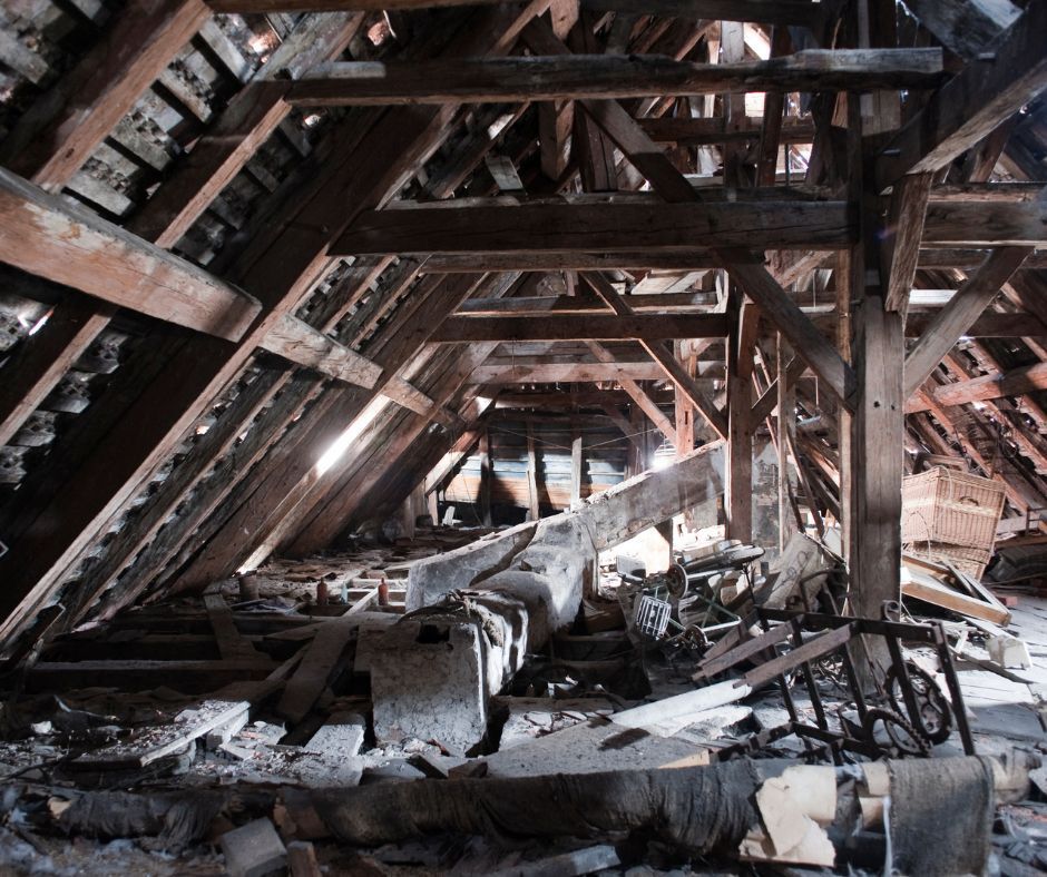 A very old attic with a lot of wooden beams