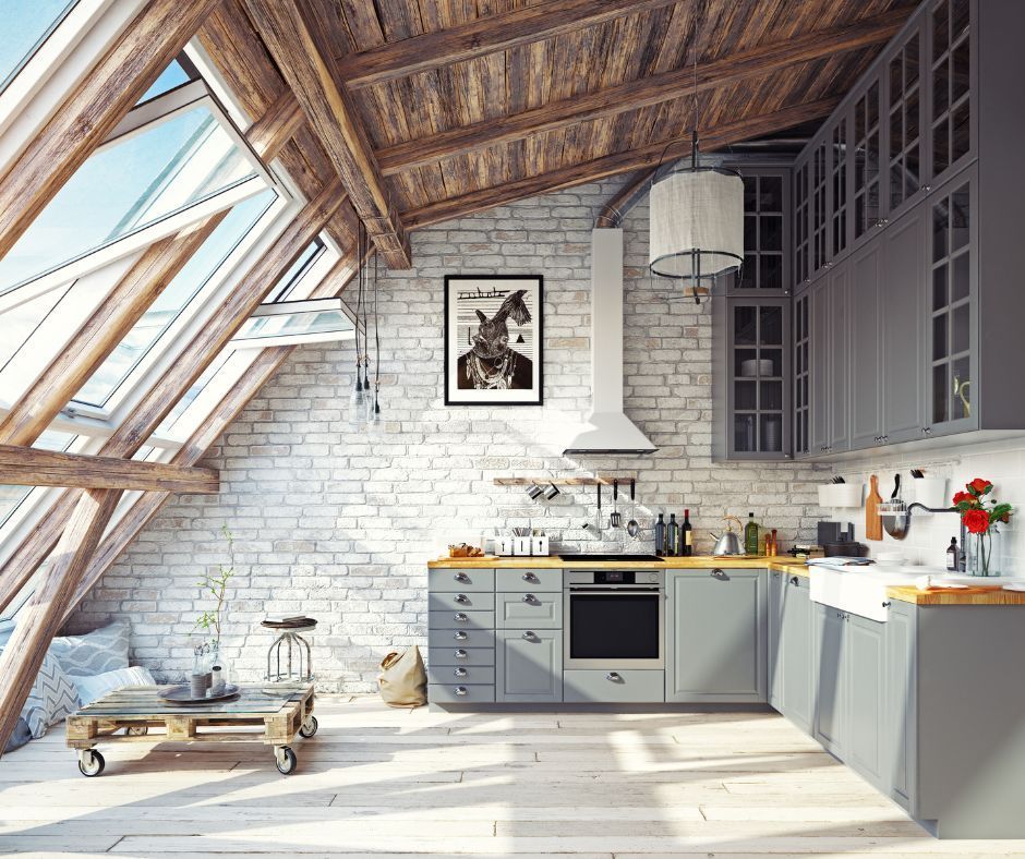 A kitchen with a lot of windows and a brick wall.