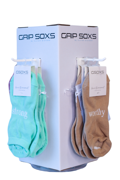 Wholesale grip socks, starter packs available with store stand for Pilates studios