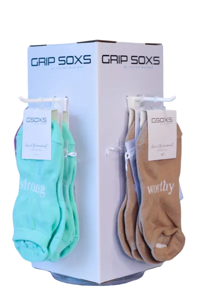 A display of GSOXS grip socks in a box