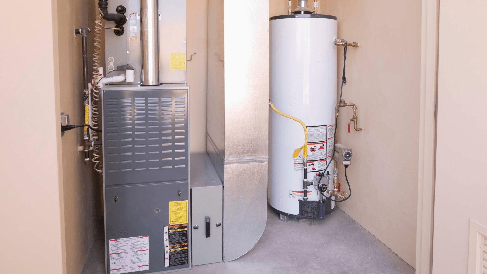 Picture of a furnace and water heater in a utility room.