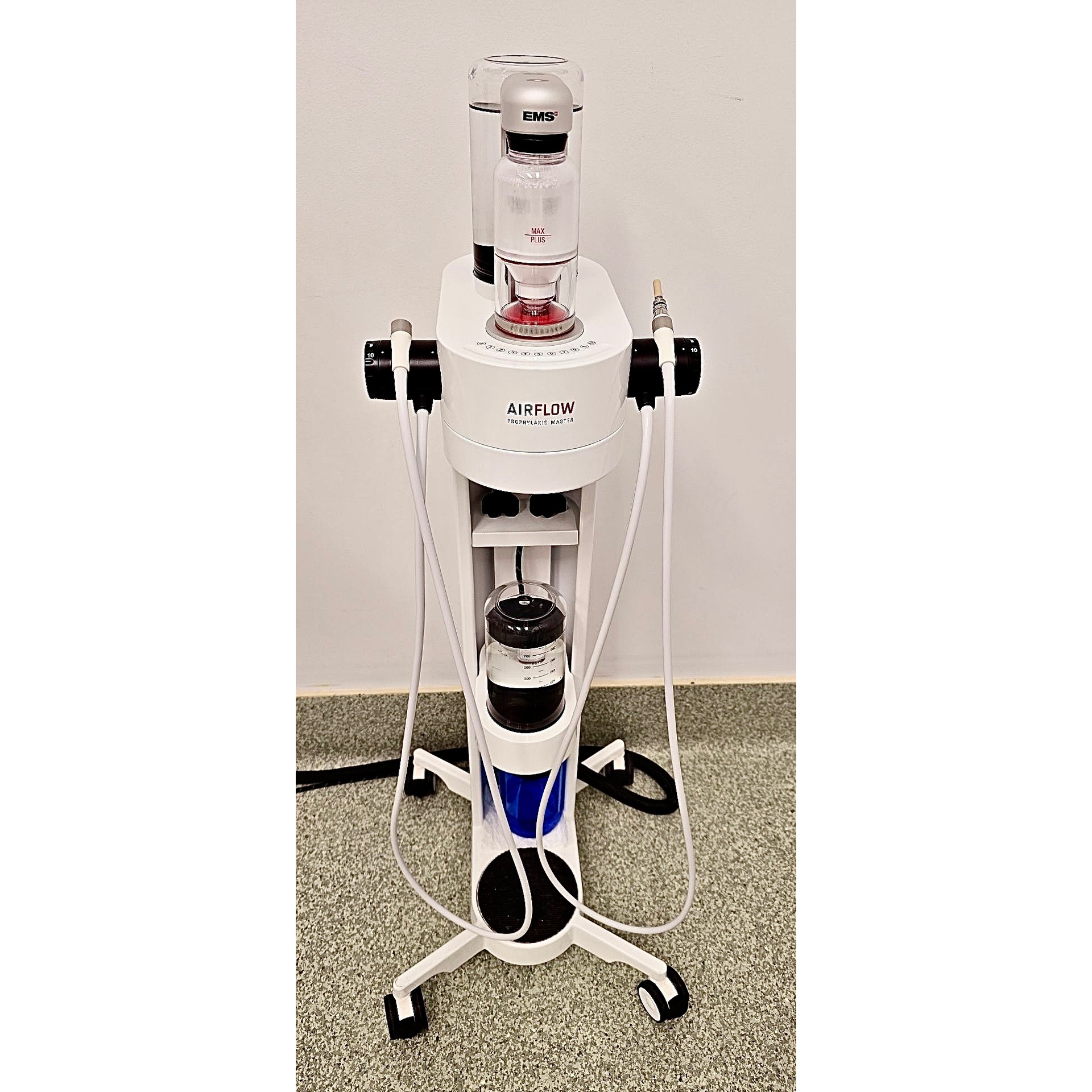 A machine is sitting on a green carpet in a room.