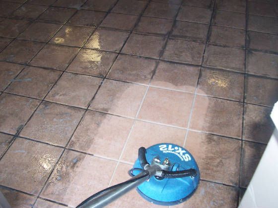 A sx12 tile cleaner is being used on a tiled floor