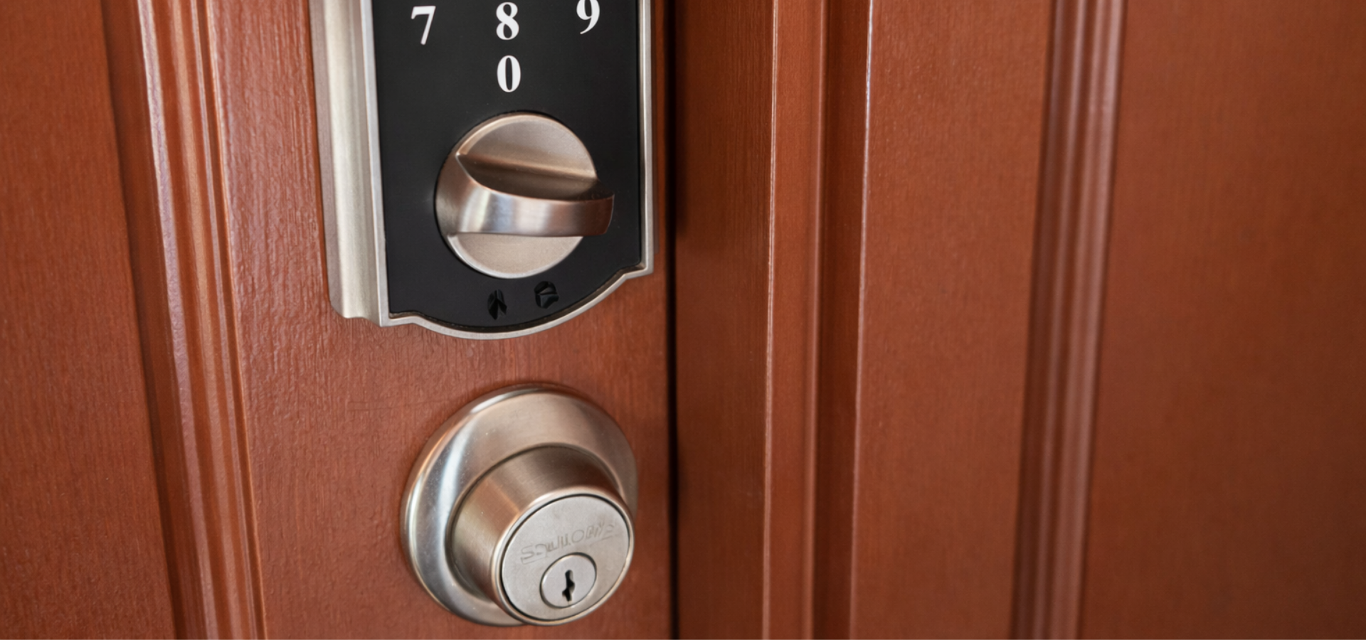 A maroon King’s Mobile Lock locksmith van parked in a lot, displaying services, phone number, and areas served in yellow.