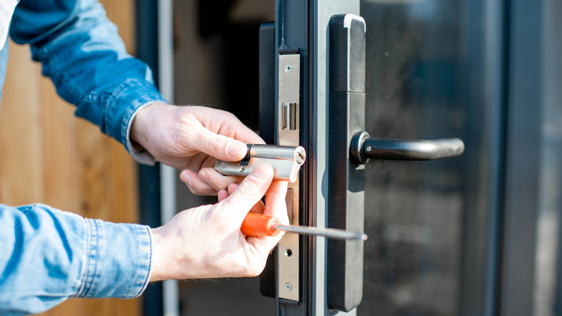 emergency locksmith inspecting damaged home lock