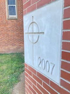 Cornerstone of SCPC new addition featuring cross and the year 2007