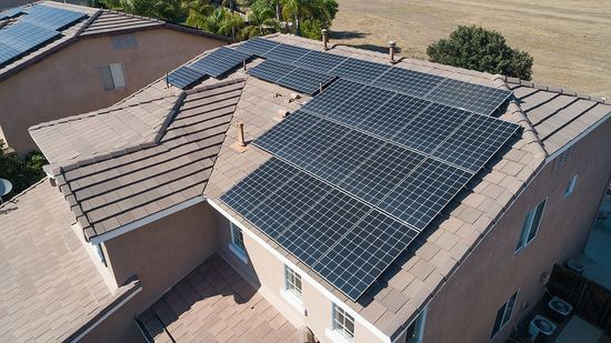 a house with a lot of solar panels on the roof