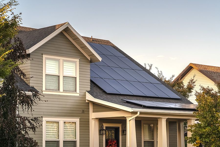 a house with a solar panel on the roof