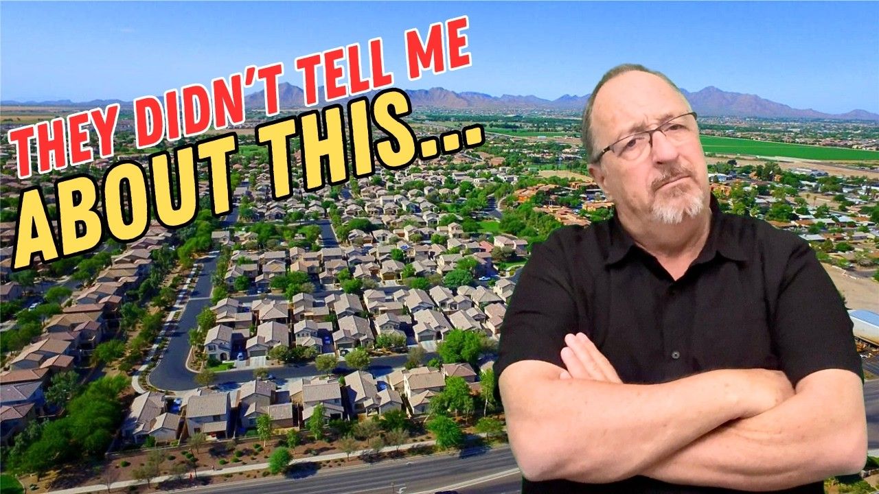 A man with glasses and arms crossed stands before a suburban neighborhood. Text reads: 