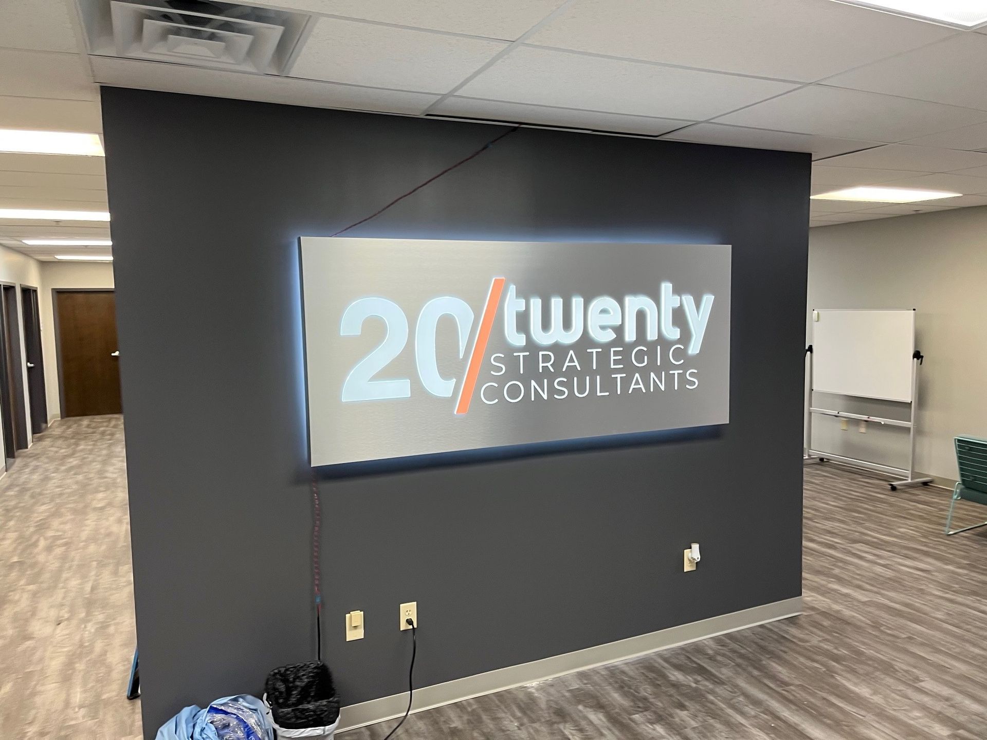 There is a sign on the wall that says twenty strategic consultants.
